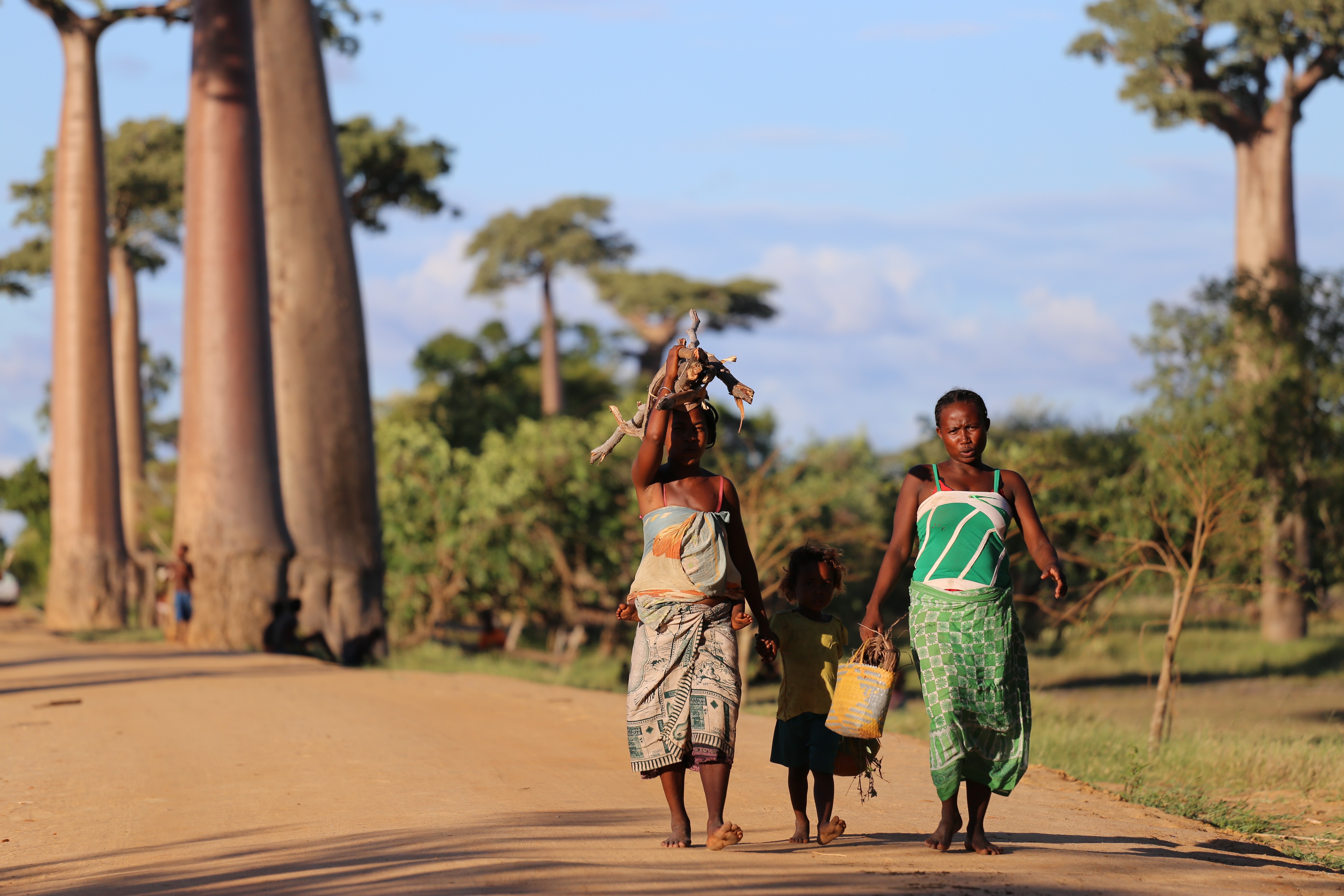 women walking with child